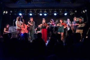 Katrina Lenk and More Perform with Their Band Youth In A Roman Field  Image