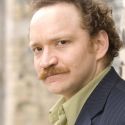 Justin R. G. Holcomb Returns to CHANNELING KEVIN SPACEY