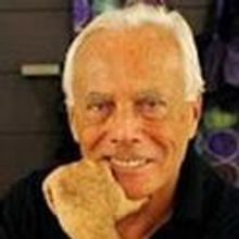 Giorgio Armani Pens Preface Versace Biography
