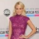 Carrie Underwood Carries Jill Milan Handbags to American Music Awards