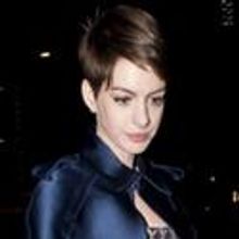Anne Hathaway Carries Jill Milan Clutch for London Premiere
