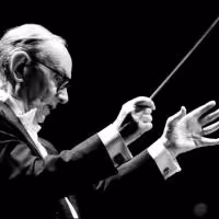 Composer and Conductor Ennio Morricone Suffers Back Injury; Postpones LA, Brooklyn…