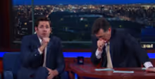 VIDEO: Watch John Krasinski & Stephen Colbert Fake Vomit While Reciting…