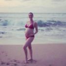 PHOTO: Anne Hathaway Beats Paparazzi to the Punch by Sharing First Baby Bump Pic