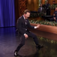 VIDEO: Michael Fassbender & Jimmy Fallon Face Off in Air Guitar Battle Video