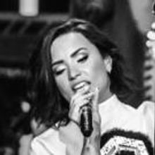 Photo Flash: Nick Jonas and Demi Lovato Take the Stage for MTV's VMA Benefit Concert