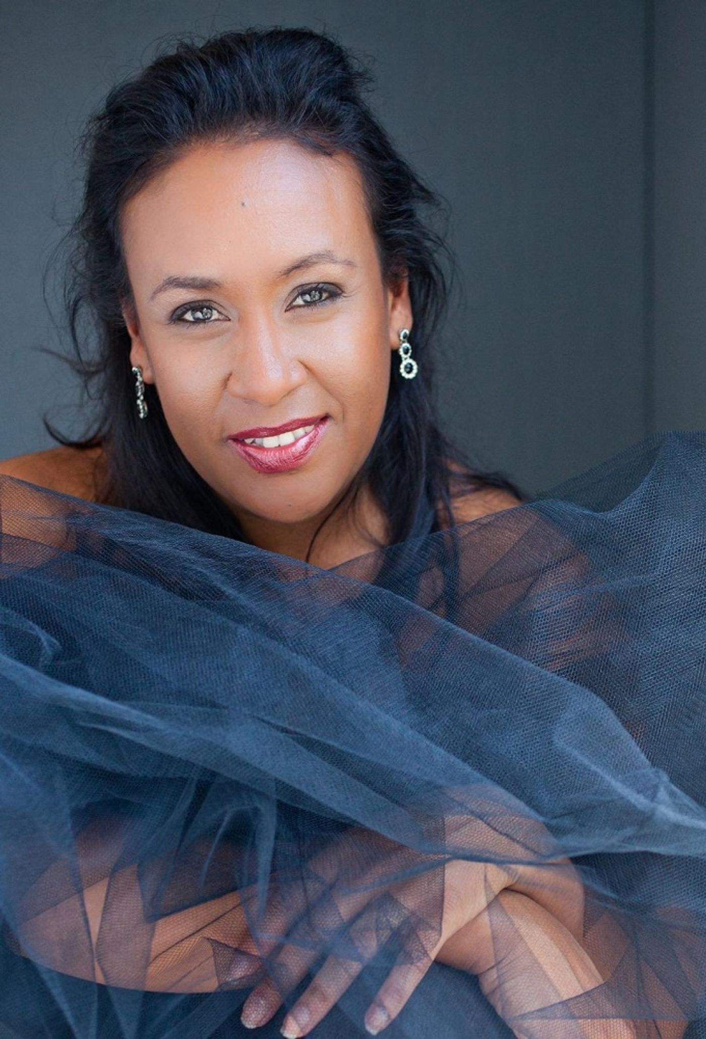 Local Comedian and MC Mel Jones Casts a Spell in International Dinner Cirque Show ENCHANTED  Image