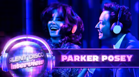 Parker Posey Tries to Talk While Wearing Noise-Canceling Headphones