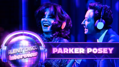 Parker Posey Tries to Talk While Wearing Noise-Canceling Headphones
