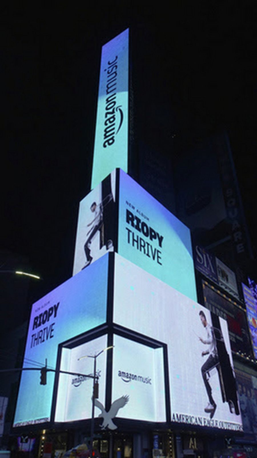 French-English Pianist RIOPY Featured on Amazon Music Times Square Billboard Image