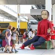 Photos: Five Metre-tall Puppet Aura Lands At Gatwick As Part Of Creative Crawley