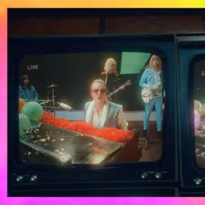Video: Cara Delevingne Stars as Elton John in New Video for 'Step Into Christmas'
