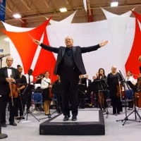 65 Piece Orchestra Accompanies Youth Violinists in Free Concert Honoring Late Music…