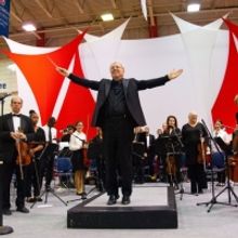 65 Piece Orchestra Accompanies Youth Violinists in Free Concert Honoring Late Music…