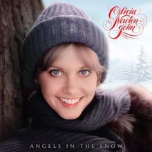 Olivia Newton-John Duets With Jane Lynch on Reimagined Holiday Album