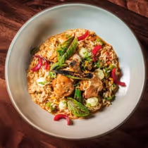 BERIMBAU BRAZILIAN TABLE 36th St. serves Brazil’s Galinhada