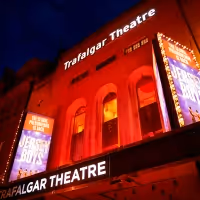 Trafalgar Theatre Lights Up in Red to Mark Year Anniversary That Theatres Went Dark