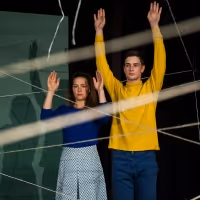 BWW Review: US/THEM is a Necessary Examination of Tragedy Through the Eyes of…
