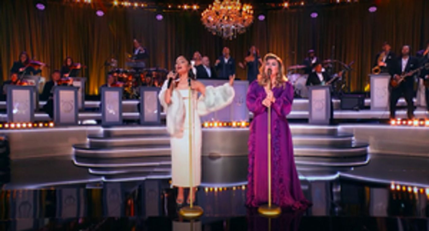 VIDEO: Ariana Grande & Kelly Clarkson Sing 'Santa, Can't You Hear Me?'  Image