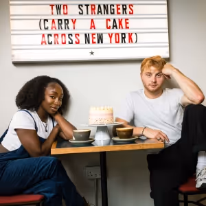 Dujonna Gift and Sam Tutty Will Lead TWO STRANGERS (CARRY A CAKE ACROSS NEW YORK) at…