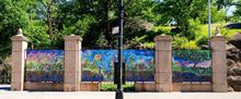 FROM ROOT TO BLOOM Mural by Singha Hon Now on View at Marcus Garvey Park Gates