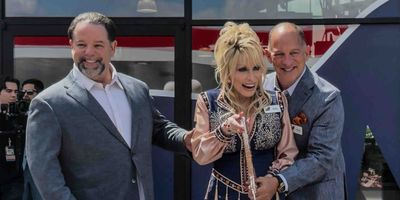Photos: Dolly Parton Makes Surprise Appearance at Grand Opening of Dolly's Tennessean Trav Photo