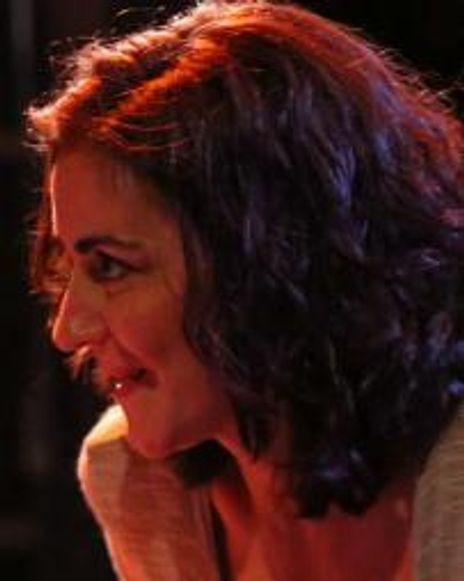 Dina Ann Comolli Headshot