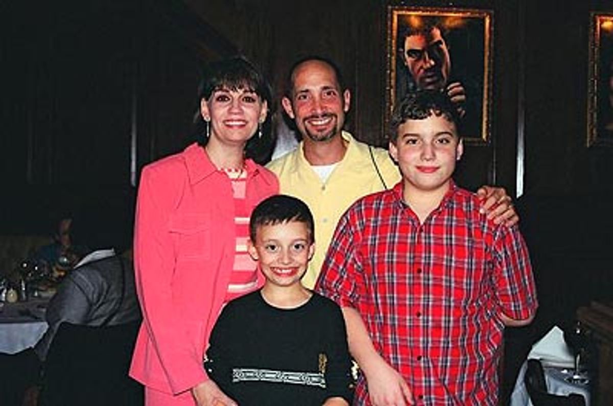 
Beth and family, husband John and son's Sam (left) and TJ (right)  at 