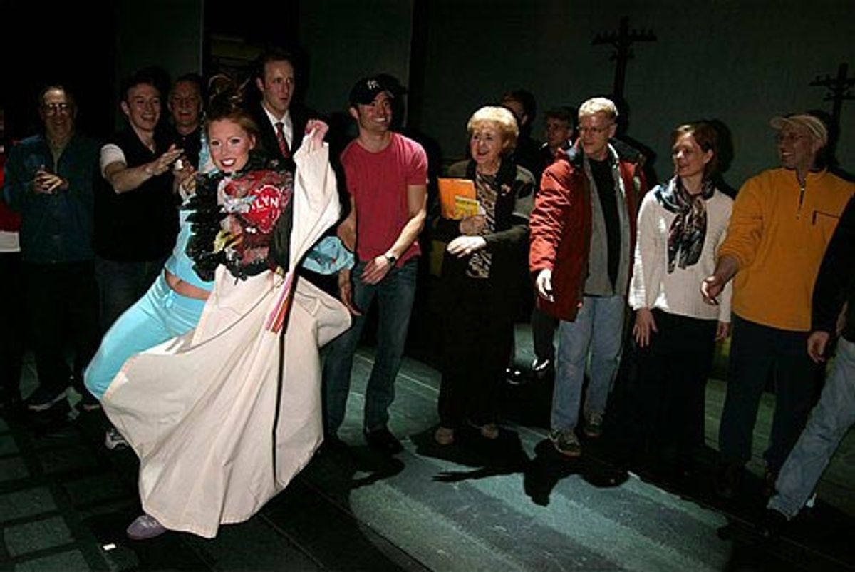 Michelle poses with the robe

 at 