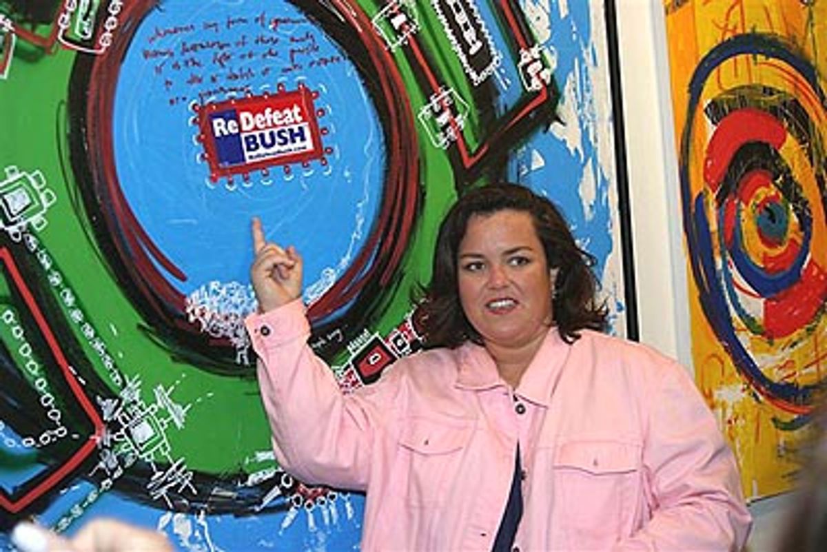 Rosie shows off one of her paintings... at 