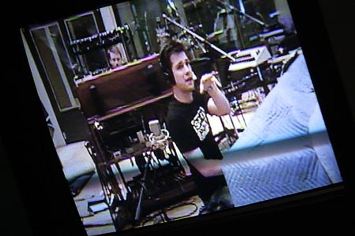 Musical supervisor and arranger Stephen Oremus through the monitor  at 