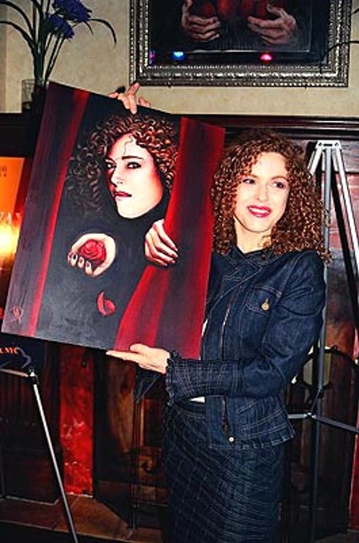 ...and showing the painting to those on the left  at 