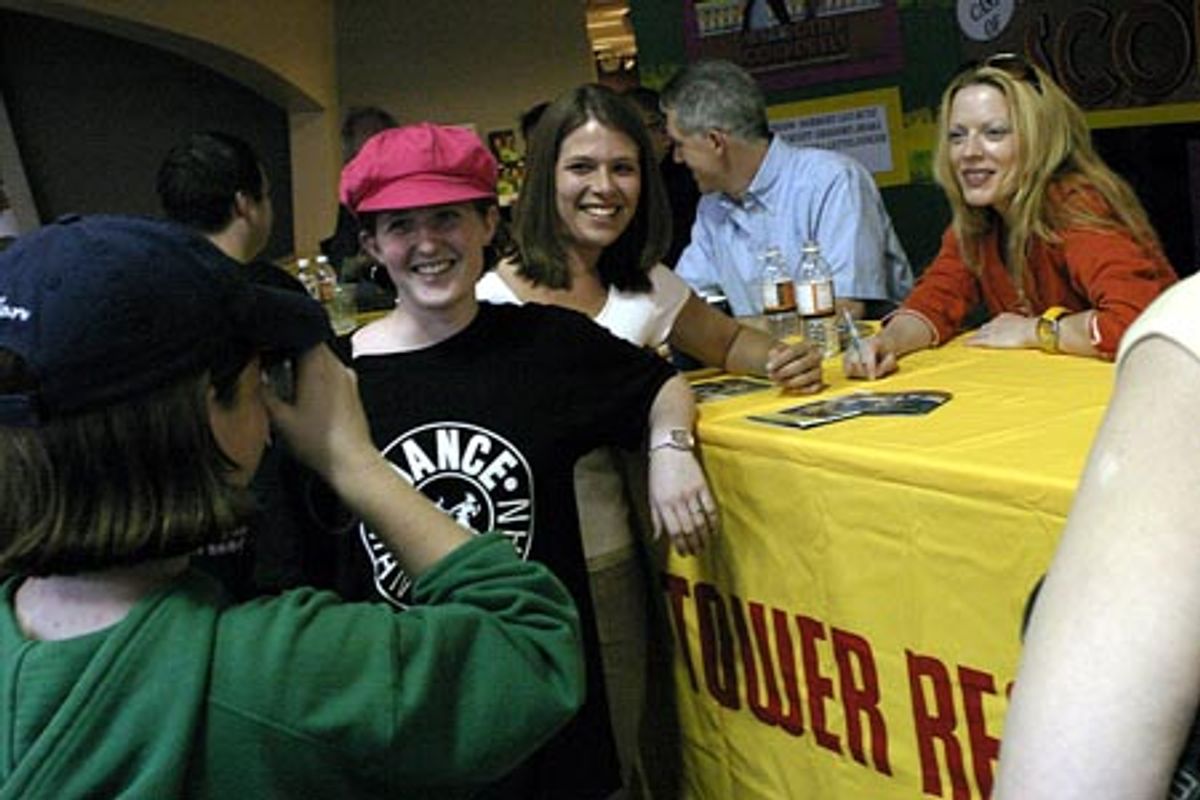 
Sherie Rene Scott posing with fans  at 