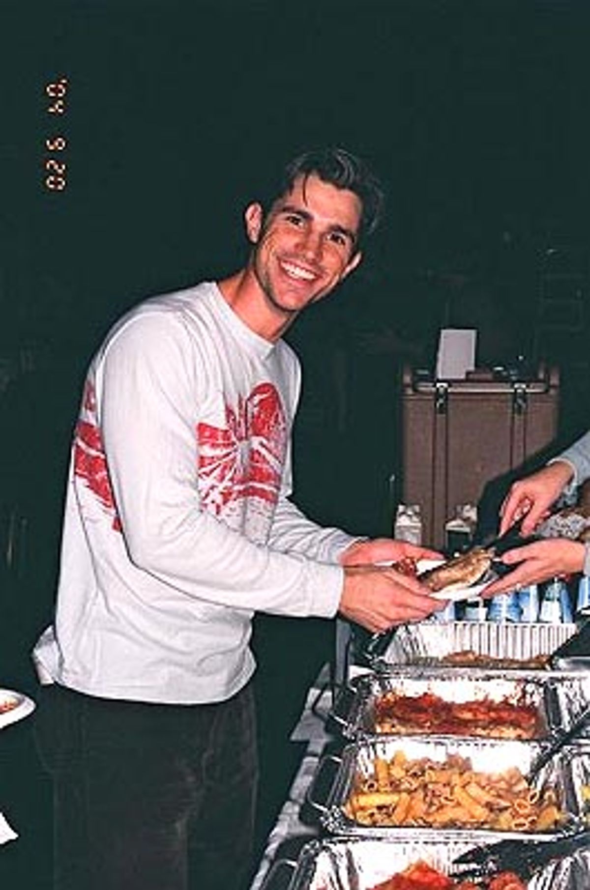 Matt Cavanaugh takes a moment to enjoy the scrumptious Italian cuisine graciously provided by Tony's DiNapoli Restaurant in Times Square.  at 