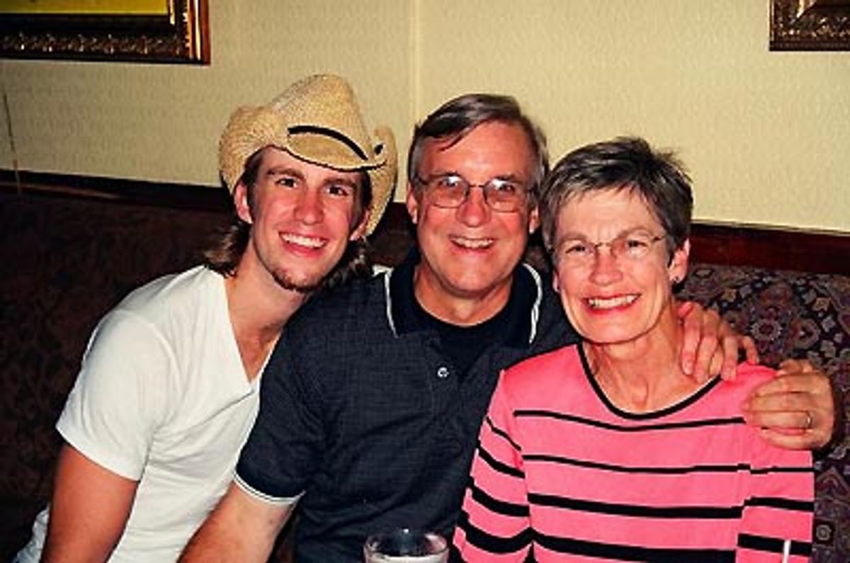 Gavin posing with his parents at 