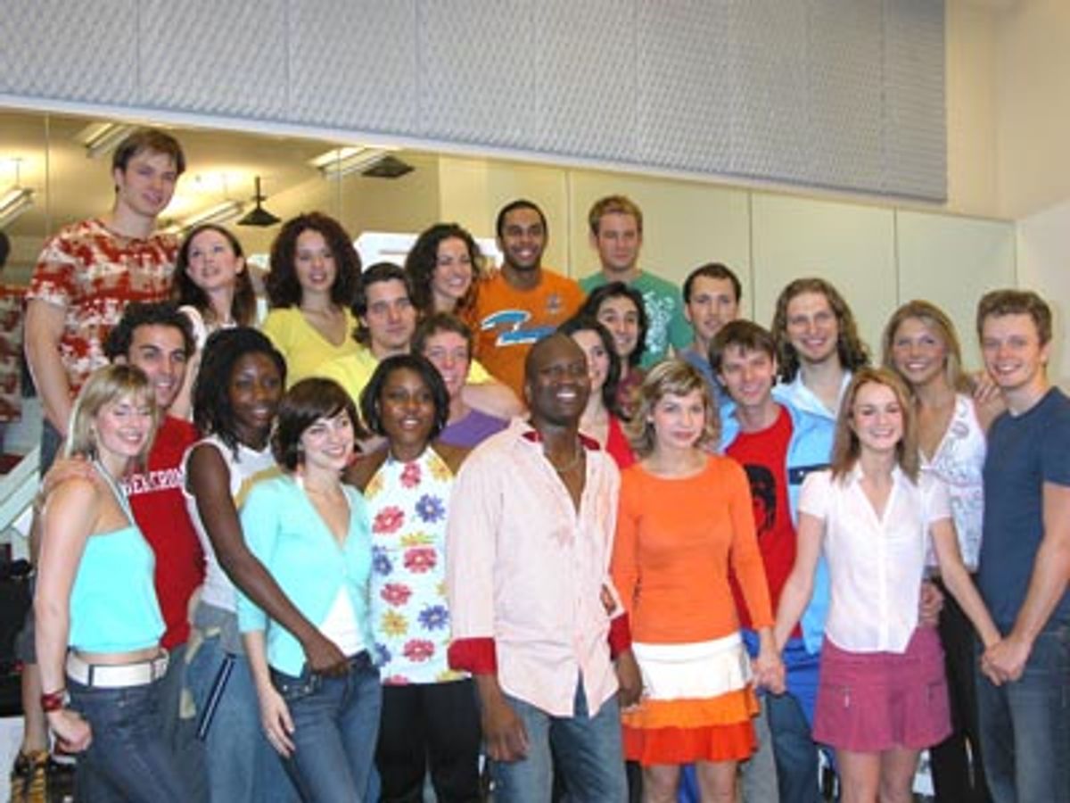 The entire cast posing for a group photo  at 