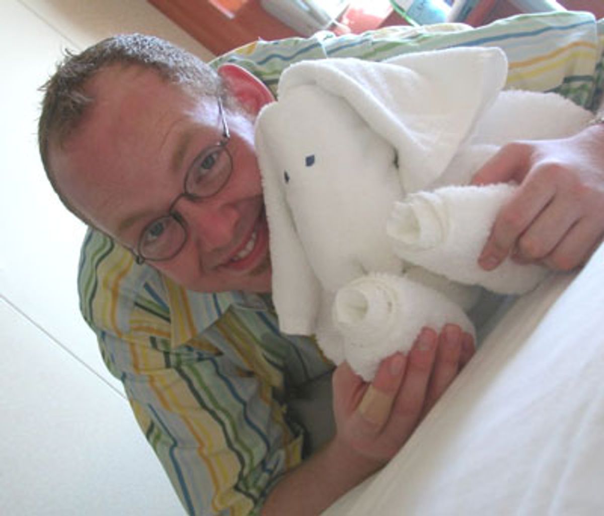 Jamie with one of the many unidentifiable towel pets left on the state room bed when the room was made up for the evening.  at 