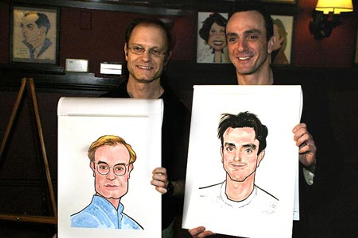 Posing with their likenesses for the camera at 