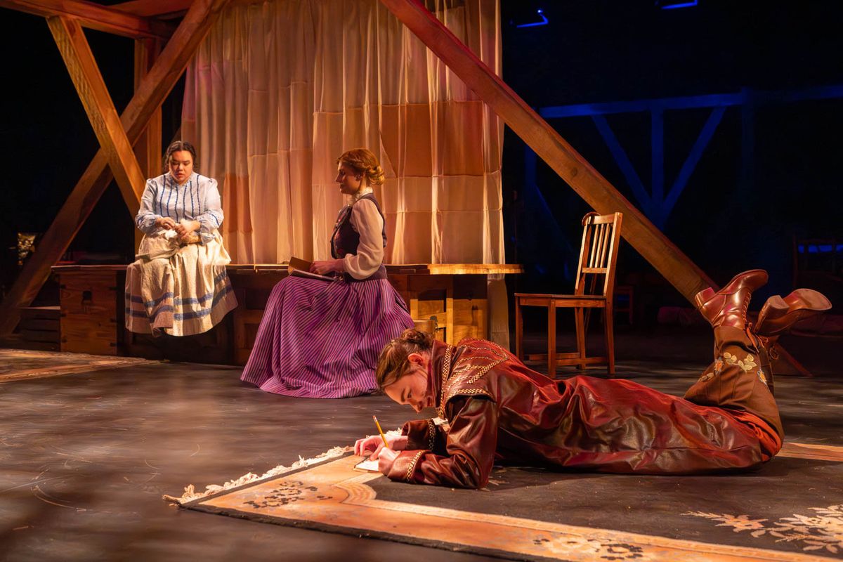 Beth, Meg, and Jo in their attic (l-r: Amy Rene Byrne, Kimie Muroya, and Mackenzie Moyer). Photo by Kyle Huggins. 