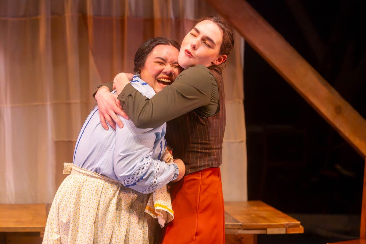 Beth (Kimie Muroya) is swept up in a hug from her older sister, Jo (Mackenzie Moyer). Photo by Kyle Huggins. 