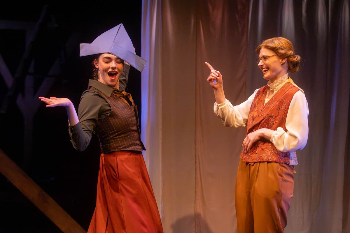 Jo (Mackenzie Moyer) teases Professor Bhaer (Amy Rene Byrne) about the hat some kids made for him. Photo by Kyle Huggins.