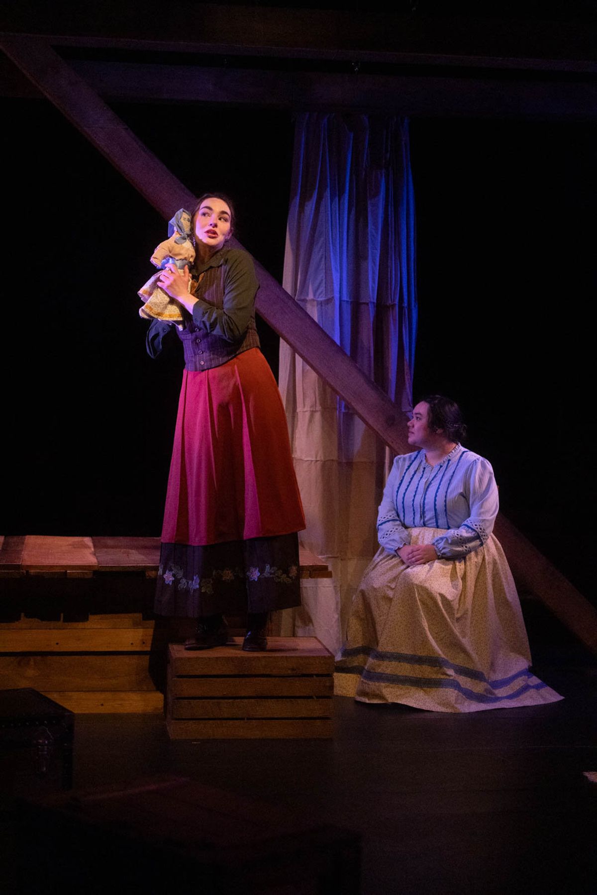 Jo (Mackenzie Moyer) hears Beth's (Kimie Muroya) voice, imploring her to keep writing. Photo by Kyle Huggins. 