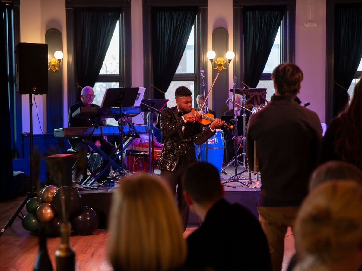Edward W. Hardy performing in front of a crowd at El Sistema Colorado's 2023 Gala event at the Savoy Denver. Edward W. Hardy performing in front of a crowd at El Sistema Colorado's 2023 Gala event at the Savoy Denver.