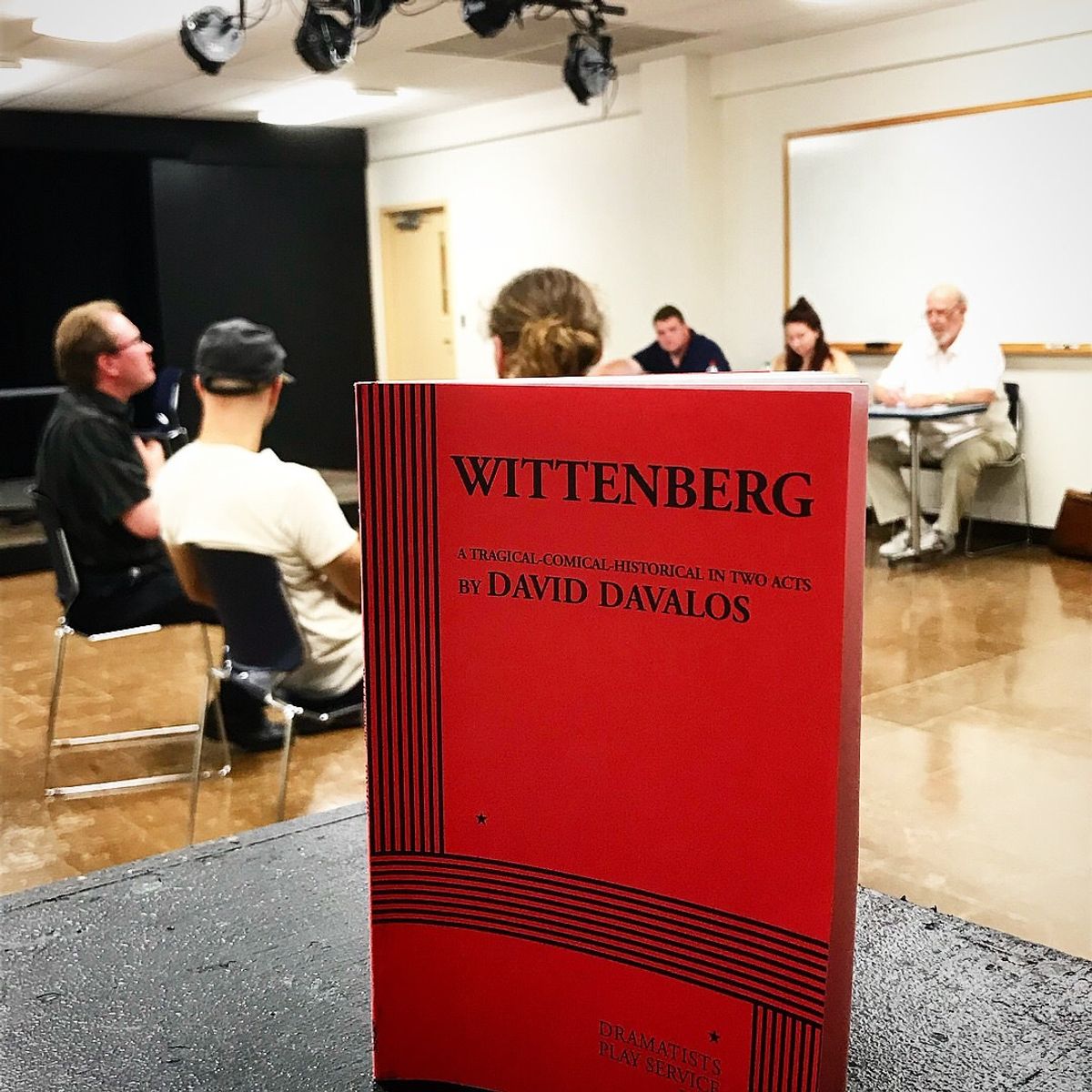 The script of WITTENBERG by David Davalos, looms over the cast during the first days of rehearsal. Photo by Dalton Hahn. The script of WITTENBERG by David Davalos, looms over the cast during the first days of rehearsal. Photo by Dalton Hahn.
