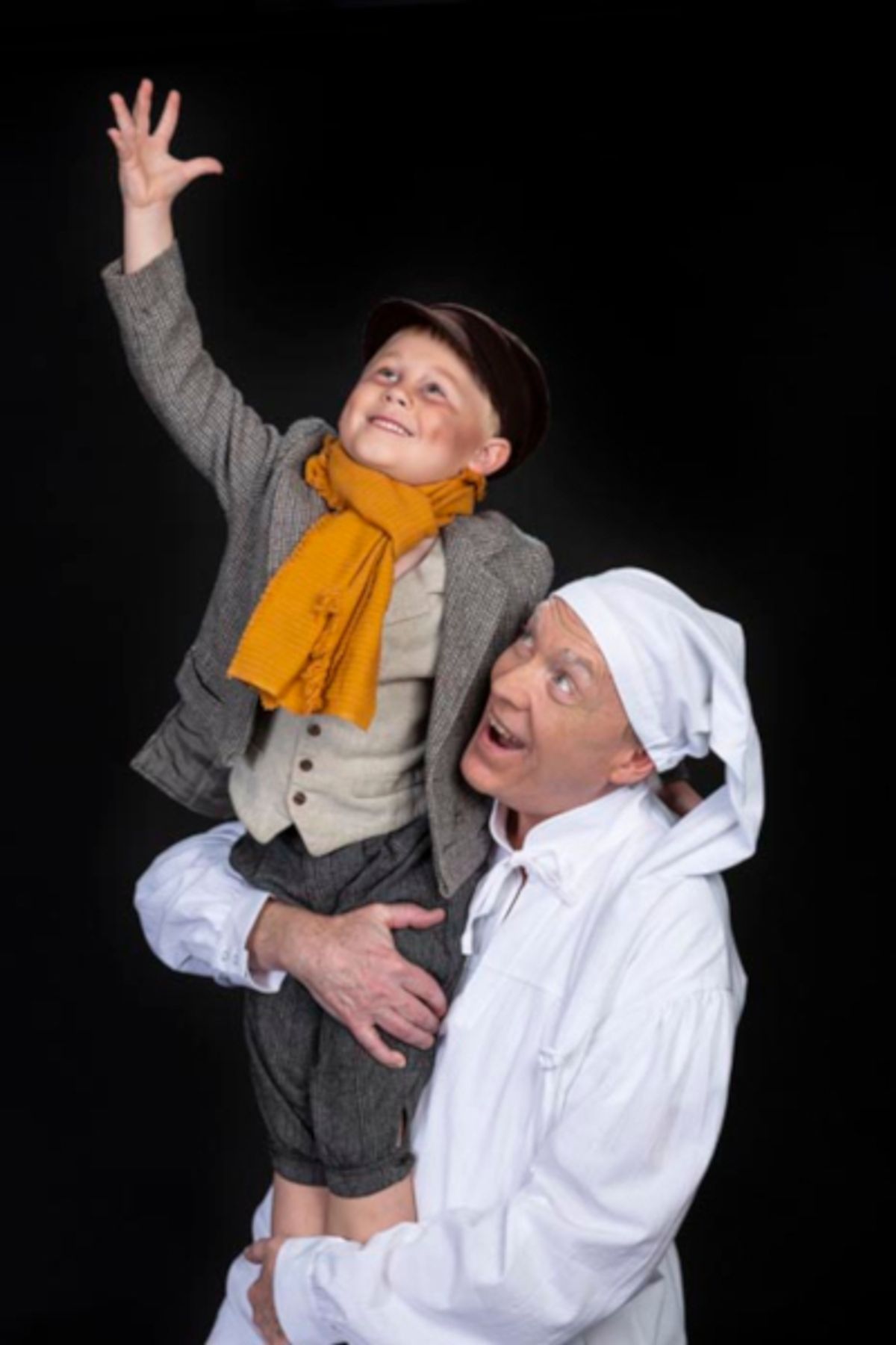 Avery May as "Tiny Tim" and George Thagard as "Ebenezer Scrooge" in Theatre Tuscaloosa's third annual production of Charles Dickens' "A Christmas Carol," playing December 10-16 in the Bean-Brown Theatre.  Photo by Porfirio Solorzano.