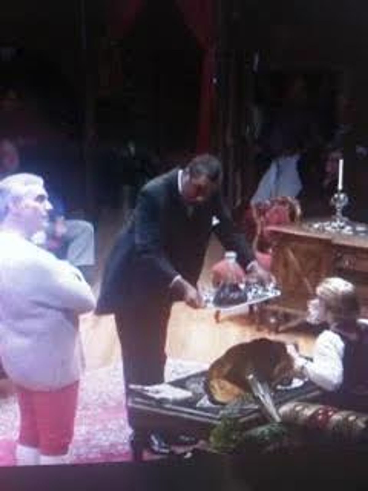 Joined onstage by Paul Michael Nieman as Mr. Anthony J. Drexel-Biddle and Andrea Stradling as Mrs. Anthony J. Drexel-Biddle, Darryl Maximilian Robinson ( center ) almost gives Service With A Smile in his role of The Butler John Lawless in the 2011 Glendale Centre Theatre 55th Anniversary Revival production of Kyle Crichton's The Happiest Millionaire.  Photo courtesy of Dash Porter.