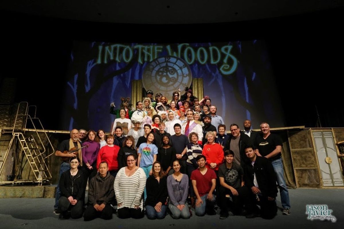 The Full Woods: Standing second from far right, Darryl Maximilian Robinson as The Narrator and The Mysterious Man is joined by the entire cast, orchestra and crew of the 2014 revival of Into The Woods