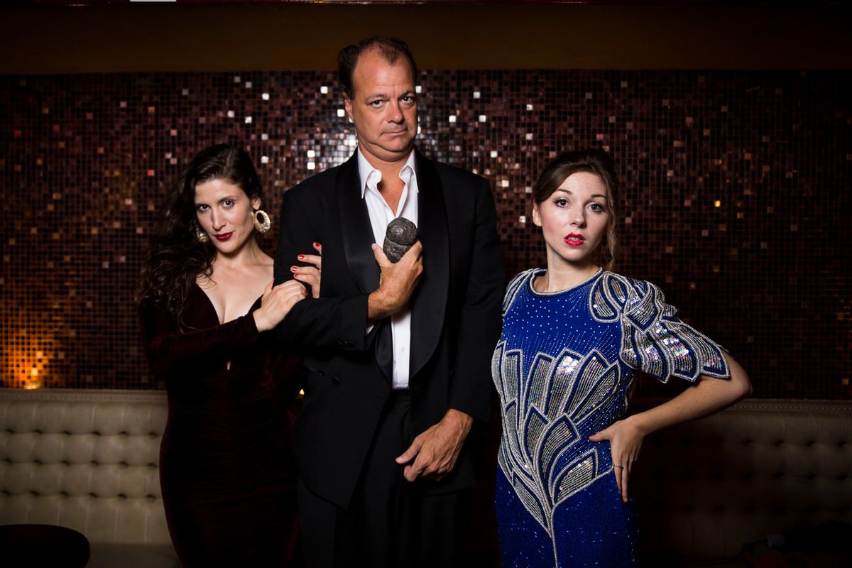 Join the Donati Family at Ciacco's as Truffles: Jazz, Murder, and Dinner Theater opens its Fall Season at Swing 46 for weekly shows beginning October 14th, with special Halloween performance at Joe's Pub at the Public on October 31st.
Cast L to R: Jenni Lark, Ron Barba, and Mikayla Petrilla
Photo Credit: Stephen Pyo. Join the Donati Family at Ciacco's as Truffles: Jazz, Murder, and Dinner Theater opens its Fall Season at Swing 46 for weekly shows beginning October 14th, with special Halloween performance at Joe's Pub at the Public on October 31st.
Cast L to R: Jenni Lark, Ron Barba, and Mikayla Petrilla
Photo Credit: Stephen Pyo.