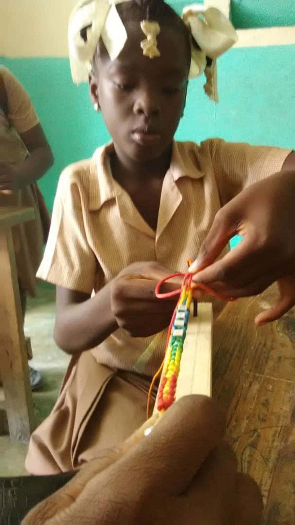 About the Jewelry:  The children from the school of L'ecole Dinaus Mixed have an after school jewelry club where they learn to make bracelet.  The Bracelet are full of vibrant colors.