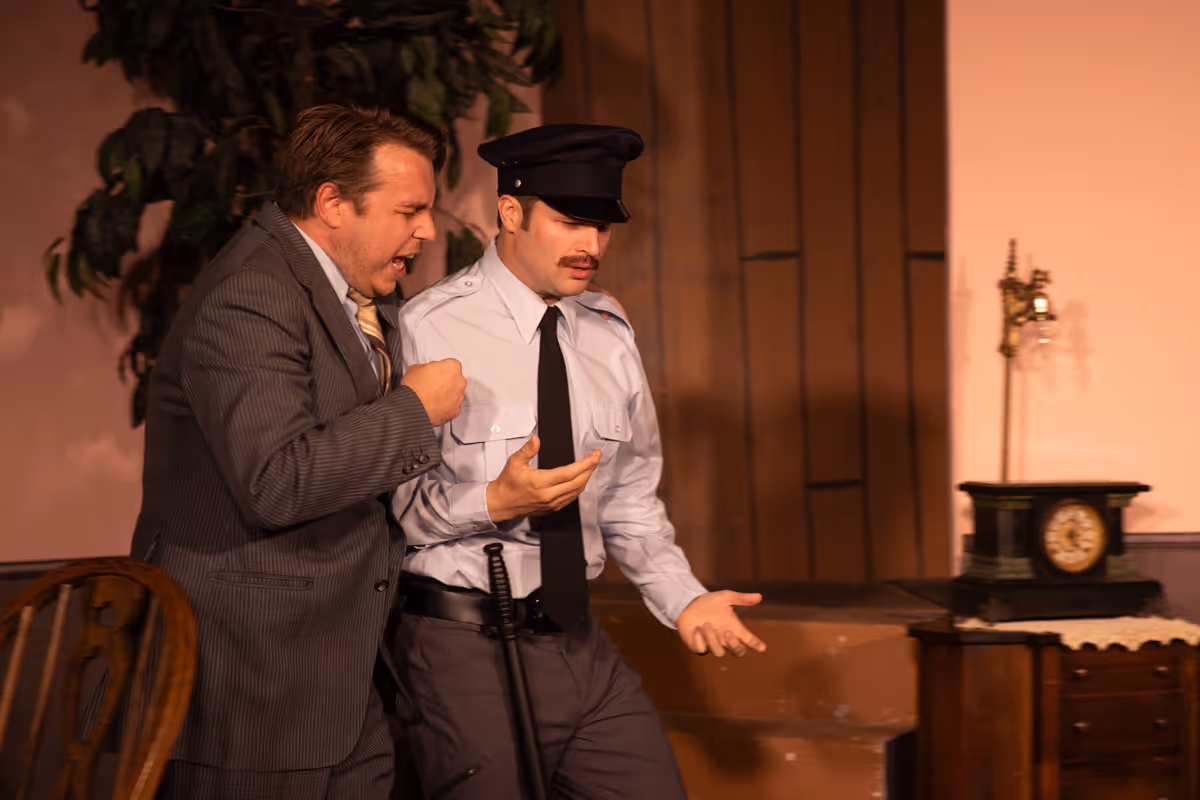 Chris Linn as MORTIMER BREWSTER and Justin Stewart as OFFICER O''HARA